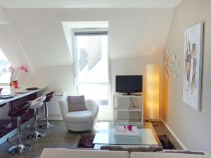 TV a/nebo společenská místnost v ubytování Apartment La Passerelle by Interhome
