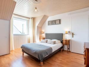 Ένα ή περισσότερα κρεβάτια σε δωμάτιο στο Holiday Home Les Elfes by Interhome