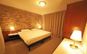 Postel nebo postele na pokoji v ubytování Galion Hôtel & Restaurant