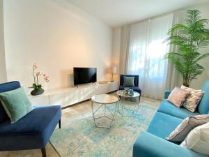 A television and/or entertainment centre at iloftmalaga Plaza Marina