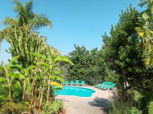 a swimming pool with lounge chairs and trees at Holiday Home Monte Meco - I in Silves