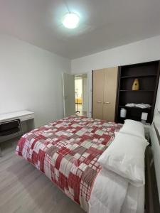 A bed or beds in a room at La Terrazza Apartment