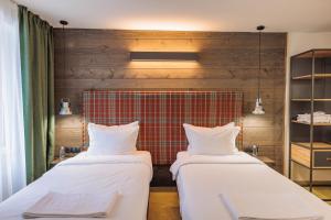 Postel nebo postele na pokoji v ubytování Iglika Hotel & Villas Borovets