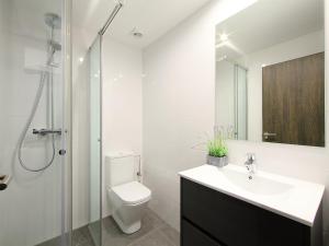 a bathroom with a sink and a toilet and a shower at Apartment Port Banyuls-1 by Interhome in Empuriabrava
