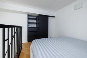 Postel nebo postele na pokoji v ubytování DuoStay