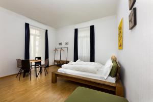 Postel nebo postele na pokoji v ubytování GuestHouse Lugano Center by LR