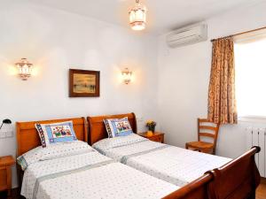 A bed or beds in a room at Holiday Home El sueno de Jeanne-Marie by Interhome