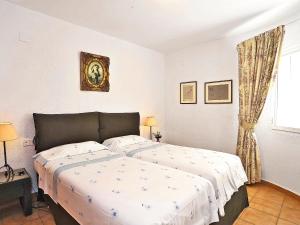 A bed or beds in a room at Holiday Home El sueno de Jeanne-Marie by Interhome