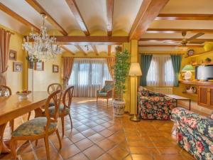 a dining room and living room with a table and chairs at Holiday Home El Arenal by Interhome in Jávea