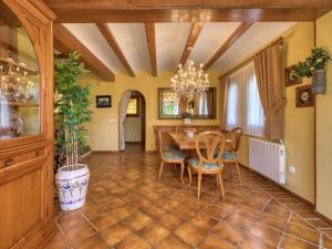 a dining room with a table and chairs at Holiday Home El Arenal by Interhome in Jávea