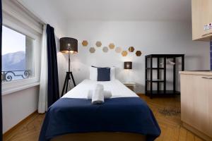 Postel nebo postele na pokoji v ubytování GuestHouse Lugano Center by LR