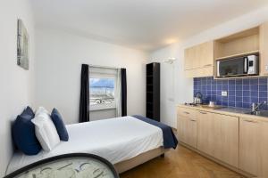 Kuchyň nebo kuchyňský kout v ubytování GuestHouse Lugano Center by LR