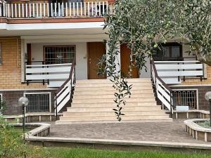 a set of stairs leading to a building at Mostacciano Roma IFO in Rome