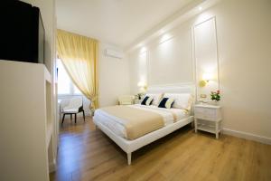 A bed or beds in a room at Viale Italia Boutique Rooms
