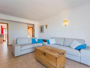 a living room with a couch and a coffee table at Apartment Sorts de la Mar-1 by Interhome in Denia +16 photos