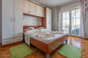 Postel nebo postele na pokoji v ubytování Apartments Vila Antula