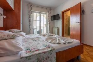 Postel nebo postele na pokoji v ubytování Apartments Vila Antula