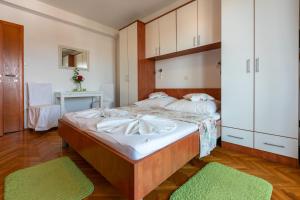 Postel nebo postele na pokoji v ubytování Apartments Vila Antula