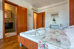 Postel nebo postele na pokoji v ubytování Apartments Vila Antula