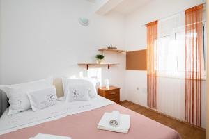 Posteľ alebo postele v izbe v ubytovaní Seaside Holiday Home Jelica
