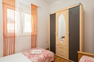 Posteľ alebo postele v izbe v ubytovaní Seaside Holiday Home Jelica