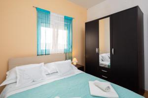 Posteľ alebo postele v izbe v ubytovaní Seaside Holiday Home Jelica