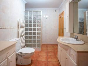 a bathroom with a toilet and a sink at Holiday Home Hope by Interhome in Adsubia