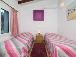 Postel nebo postele na pokoji v ubytování Holiday Home Villa Paradise by Interhome