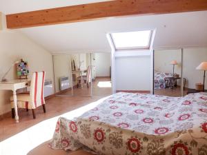 a bedroom with a bed and a table and a desk at Apartment Le Panoramic by Interhome in Sainte-Maxime