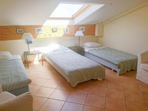 a room with two beds and a skylight at Apartment Le Panoramic by Interhome in Sainte-Maxime +17 photos