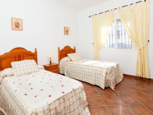 Posteľ alebo postele v izbe v ubytovaní Holiday Home Villa Miradri by Interhome
