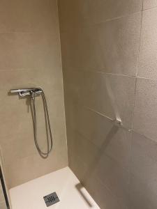 a shower stall in a bathroom with a toilet at CASA ENEKO in Seville