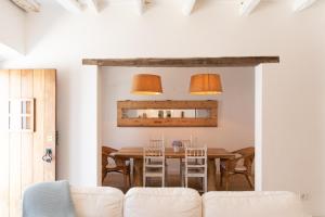 a dining room with a table and chairs at Casa da Avó Pam in Alcáçovas
