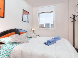 En eller flere senge i et værelse på Apartment Windsor by Interhome