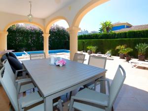 a dining table and chairs on a patio at Holiday Home Casa Kate by Interhome in Calpe
