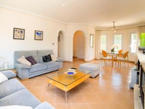 a living room with a couch and a table at Holiday Home Casa Kate by Interhome in Calpe +17 photos