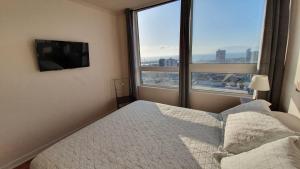 Voodi või voodid majutusasutuse Antofagasta Sunset - Amplio Departamento con Home Office y Vista Mar toas