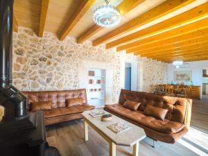 a living room with a couch and a wood stove at Holiday Home Can Blancos by Interhome in Inca