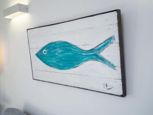a painting of a blue fish on a wall at Apartment Apartamento Maritimo by Interhome in Benitachell