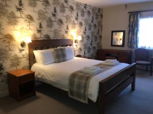 A bed or beds in a room at The Old Bell - Warminster