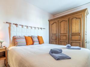 a bedroom with a bed with two towels on it at Apartment Sol i Canal by Interhome in Empuriabrava