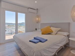 Ένα ή περισσότερα κρεβάτια σε δωμάτιο στο Apartment Bahia-9 by Interhome