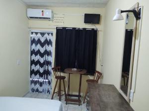 Un televizor și/sau centru de divertisment la Suitezinha Verolme - Angra dos Reis - RJ