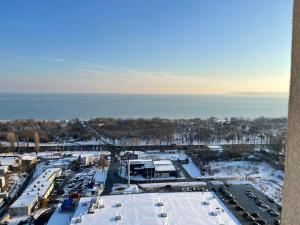 an aerial view of a parking lot with the water at Морской бриз in Odesa