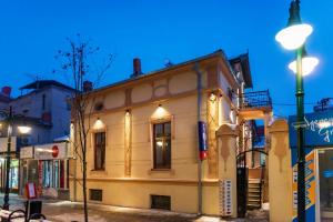 a building on a city street at night at MariaApartments in Bitola