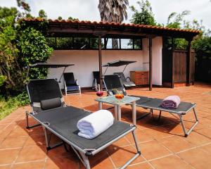 a group of chairs and tables on a patio at Casa Adassa in El Paso