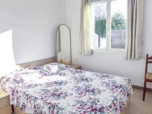 Ένα ή περισσότερα κρεβάτια σε δωμάτιο στο Holiday Home Philibert by Interhome