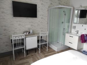 Postel nebo postele na pokoji v ubytování Chambre HORTENSIA