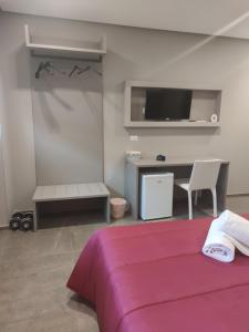 A bed or beds in a room at Hotel Valle Verde