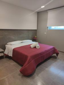 A bed or beds in a room at Hotel Valle Verde